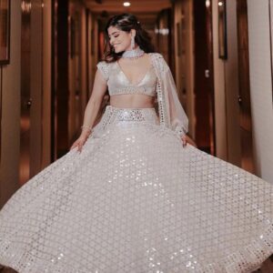 A preety girl wearing gorgeous white lehenga