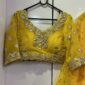 Haldi special yellow lehenga with paper mirror work and flowy flare