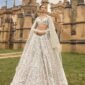 Ivory net lehenga with 3.25 meter flair, sequins, dori and thread work