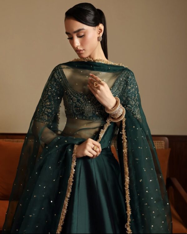 Emerald green malai satin lehenga set with net dupatta stone work