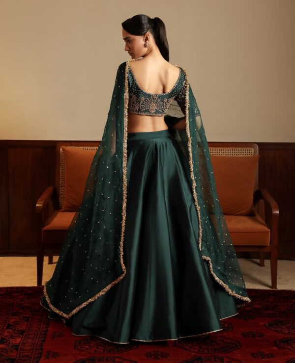 Emerald green malai satin lehenga set unstitched blouse back design