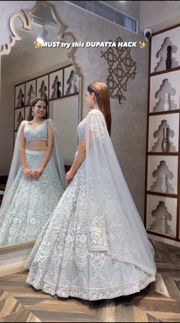 Lightweight pastel bridal lehenga with heavy embroidery