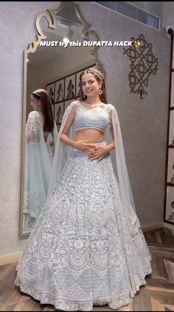 Pastel blue net lehenga with 3.25 meter flair and can can bridal outfit